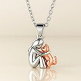 Necklace with a cat hug pendant
