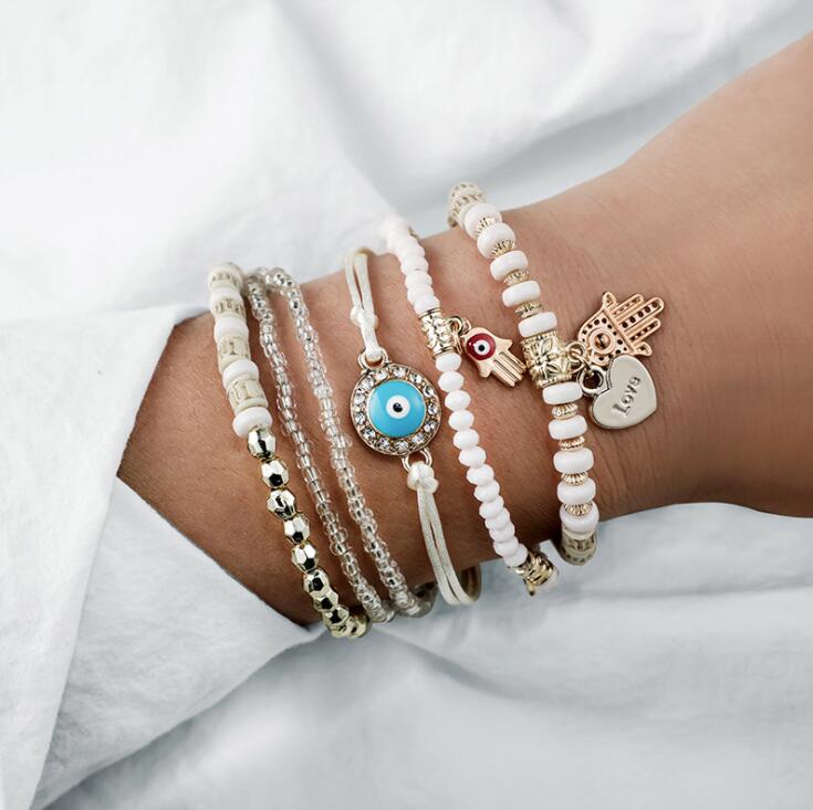 Set di bracciali dorati Hamsa