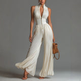 White sleeveless V-neck jumpsuit with zip closure.