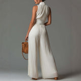 White sleeveless V-neck jumpsuit with zip closure.