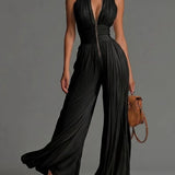 White sleeveless V-neck jumpsuit with zip closure.