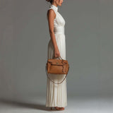 White sleeveless V-neck jumpsuit with zip closure.
