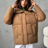 Piumino oversize da donna con cappuccio e tasche