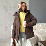 Piumino oversize da donna con cappuccio e tasche