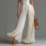White sleeveless V-neck jumpsuit with zip closure.