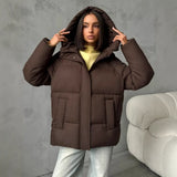 Piumino oversize da donna con cappuccio e tasche