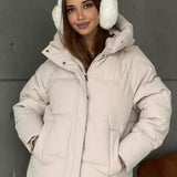 Piumino oversize da donna con cappuccio e tasche