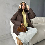 Piumino oversize da donna con cappuccio e tasche