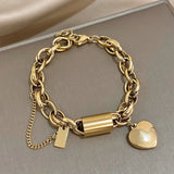 Bracciale dorato a maglie grandi con cuore