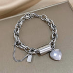 Bracciale dorato a maglie grandi con cuore