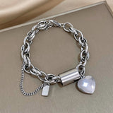 Bracciale dorato a maglie grandi con cuore