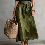 Vera | Black shirt and olive skirt