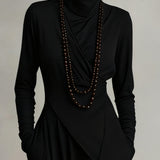 Aurelia · Vestito maxi plissettato asimmetrico con colletto alto