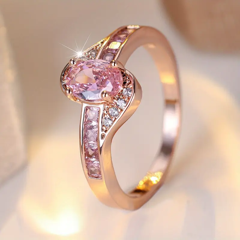 Anello dorato con cristallo rosa – Immagine 1