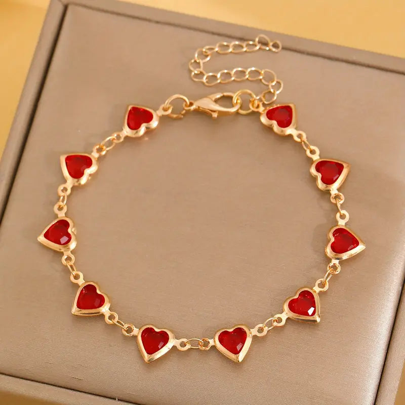 Bracciale dorato con cuore rubino – Immagine 1