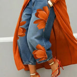 Esley | Camicia lunga e jeans con motivo floreale
