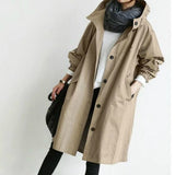 Trench lungo da donna con cappuccio e chiusura con bottoni