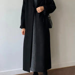 Cappotto lungo elegante da donna con cintura e revers