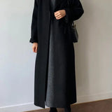 Cappotto lungo elegante da donna con cintura e revers