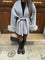 Cappotto da donna con cintura e maniche in pelliccia sintetica