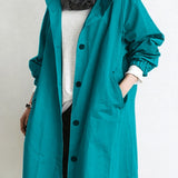 Cappotto lungo da donna con cappuccio e bottoni classici