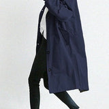 Trench lungo da donna con cappuccio e bottoni