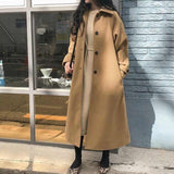 Trench lungo da donna con vita sagomata e collo classico