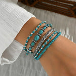 Set di bracciali con perline turchesi – Immagine 1