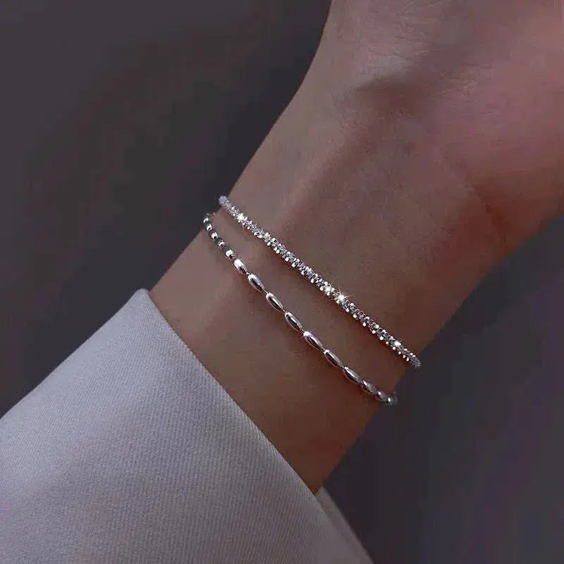 Set di eleganti bracciali argentati con zirconi – Immagine 1