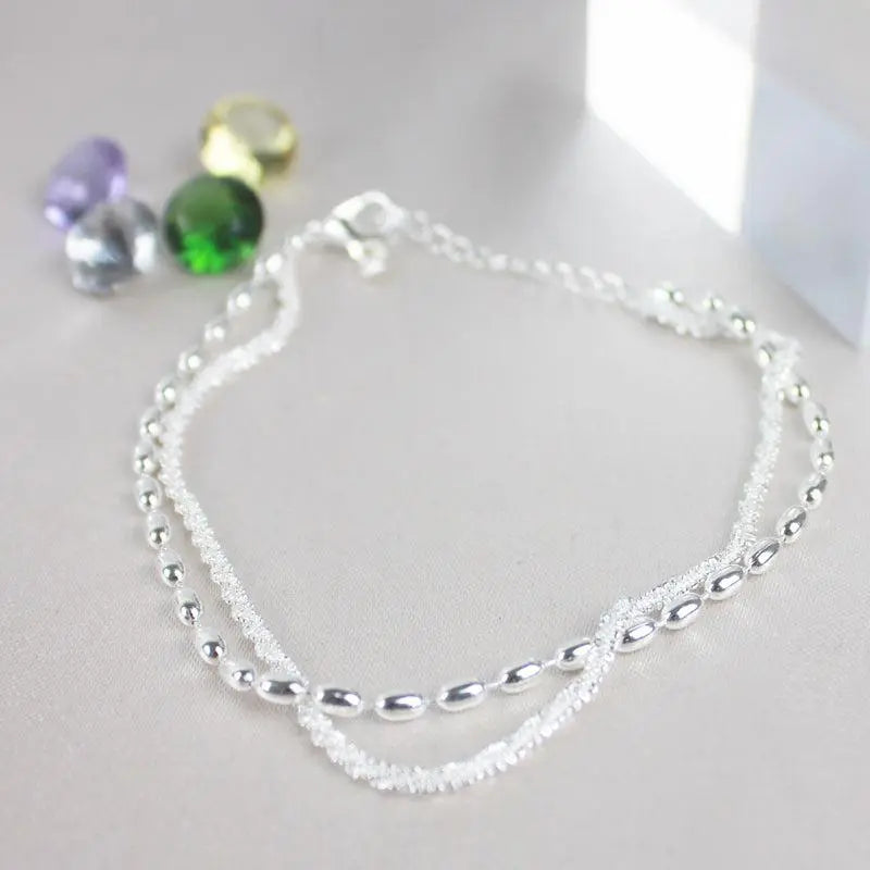 Set di eleganti bracciali argentati con zirconi – Immagine 2