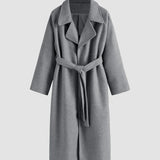 Cappotto lungo da donna con cintura e revers elegante